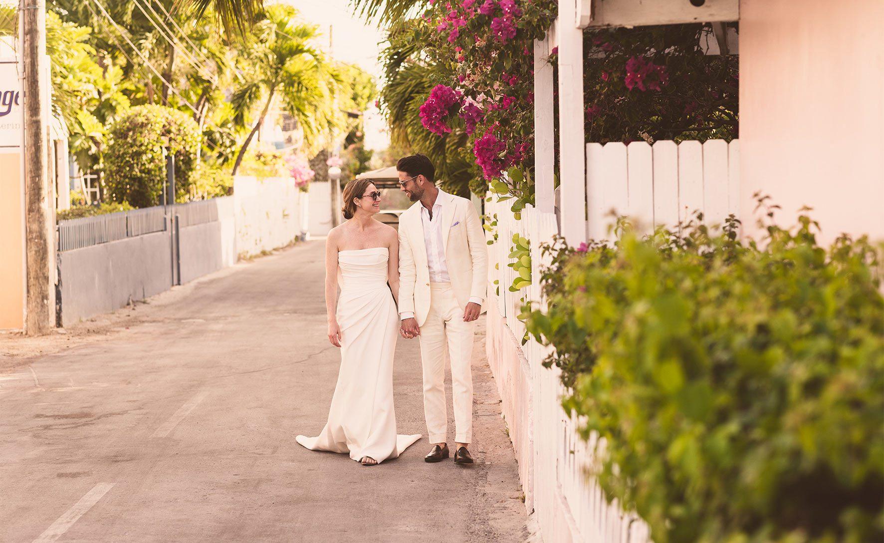 bride and groom walking down the streets of Dunmore Town