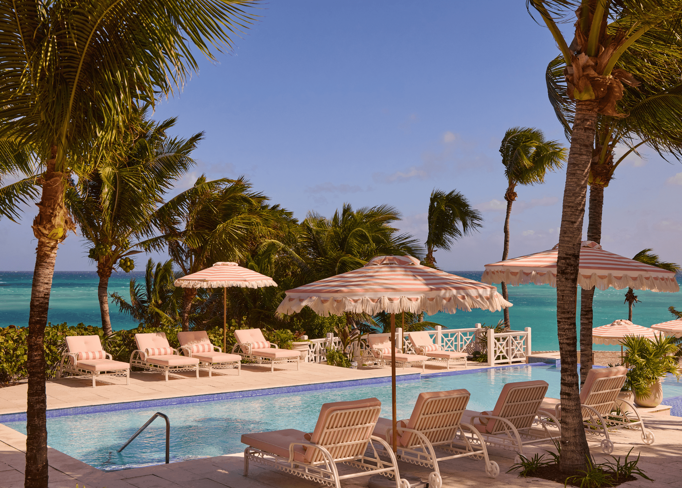 image of pink lounge chairs by the pool