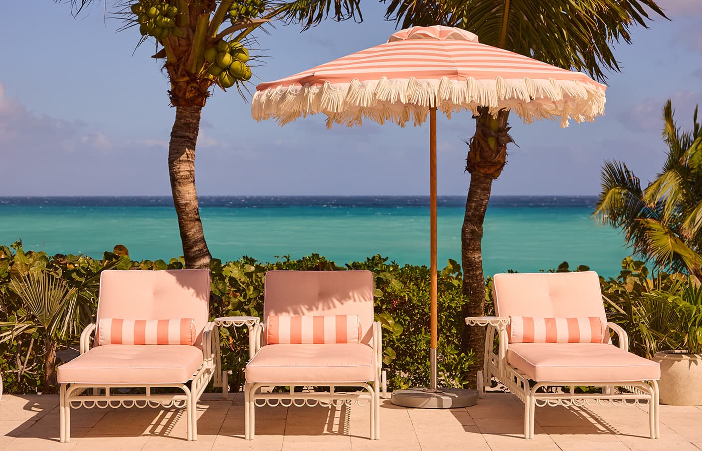 pool loungers with ocean view