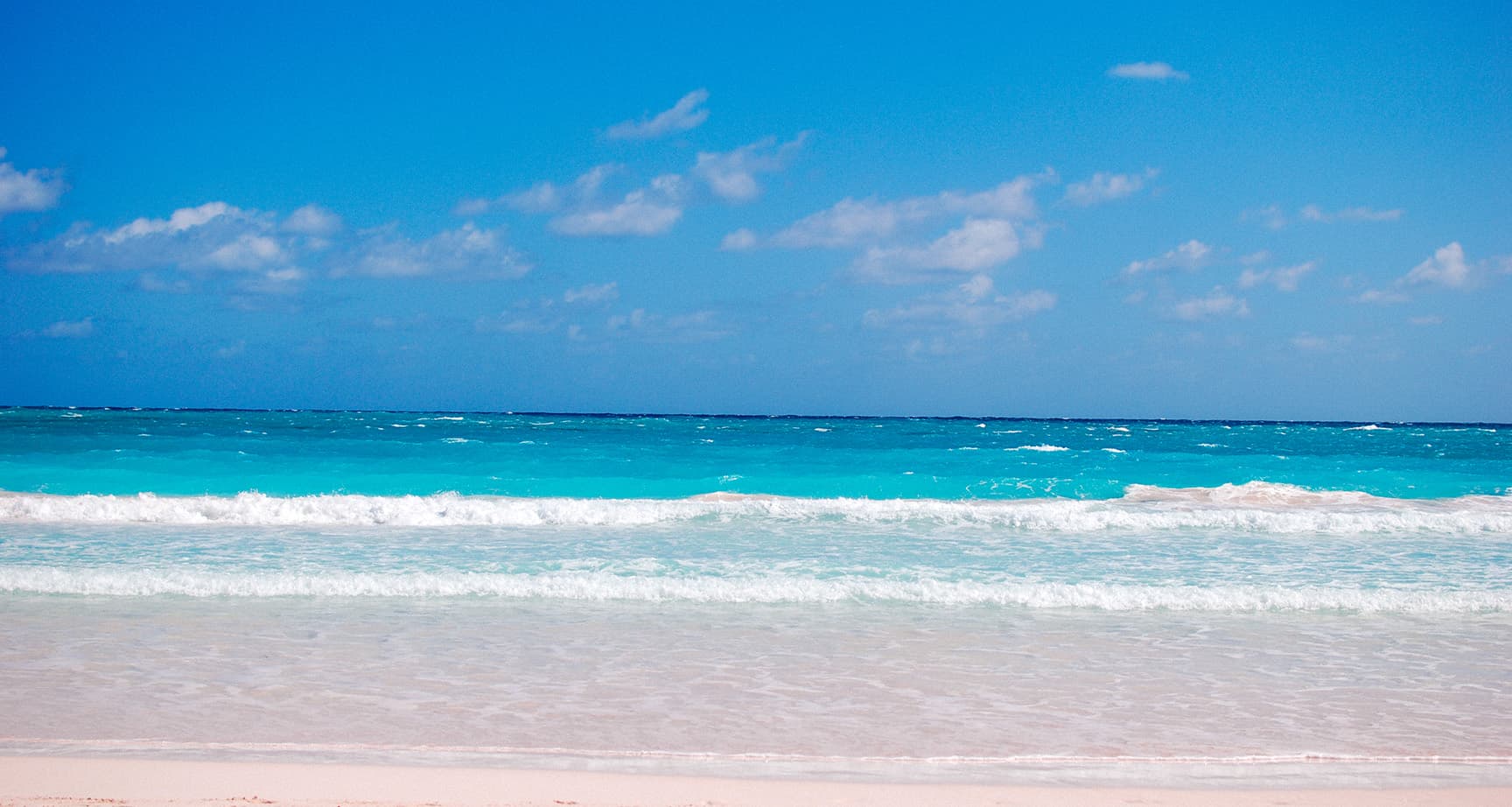 pink sand and turquoise water