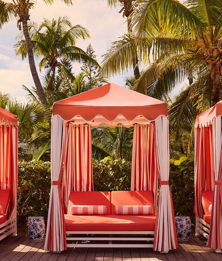 pink and white striped pool cabana